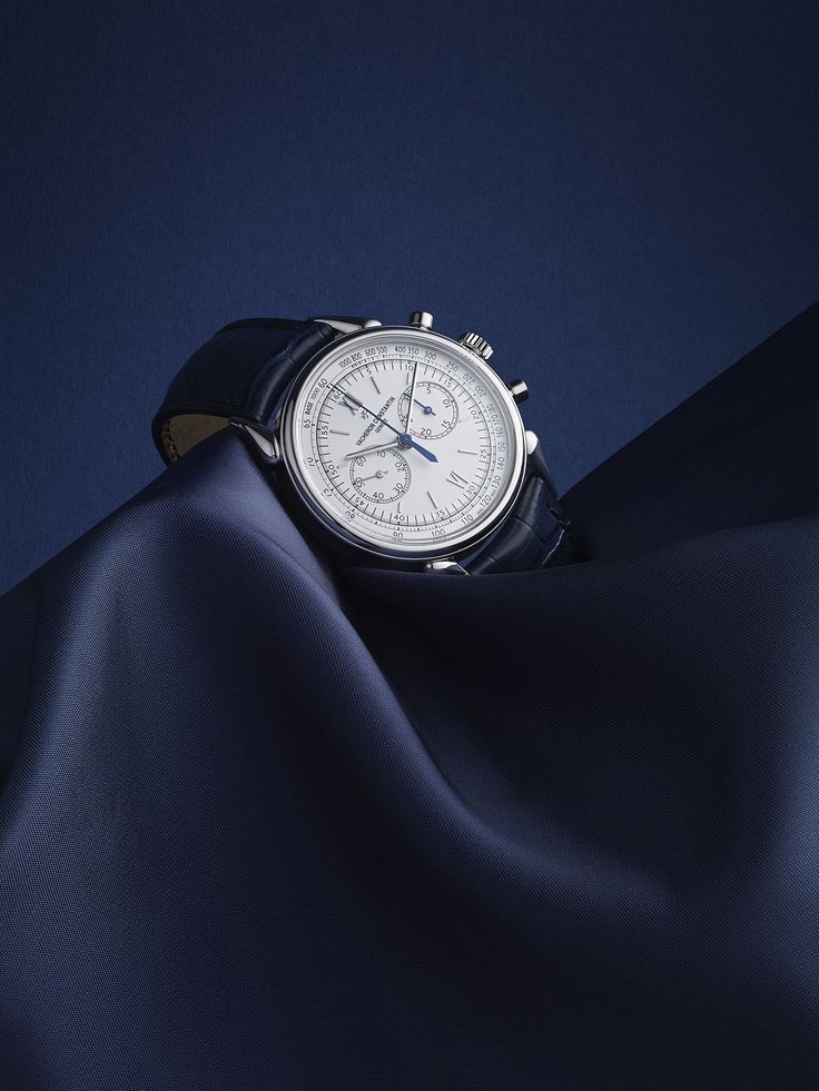 Luxury Wristwatch On Blue Silk Drapery Genflow template preview