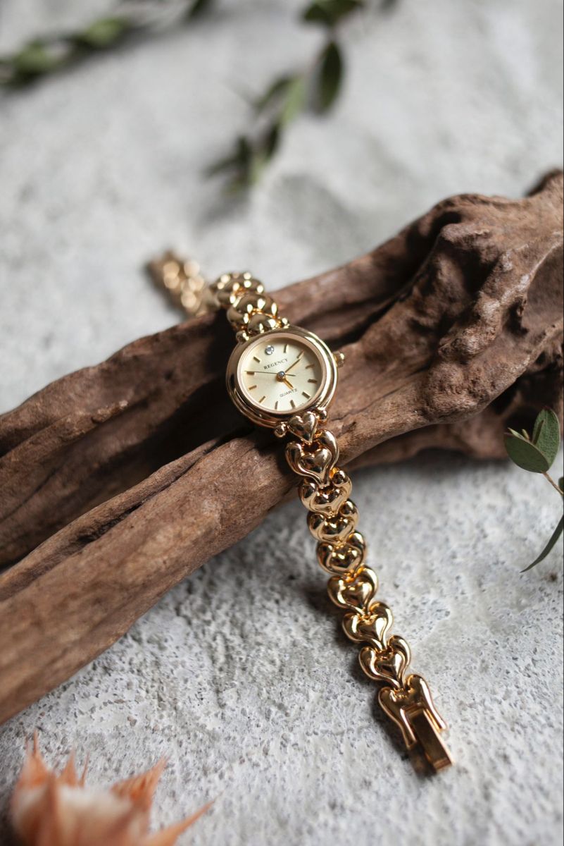 Elegant Gold Bracelet Watch On Driftwood Genflow template preview