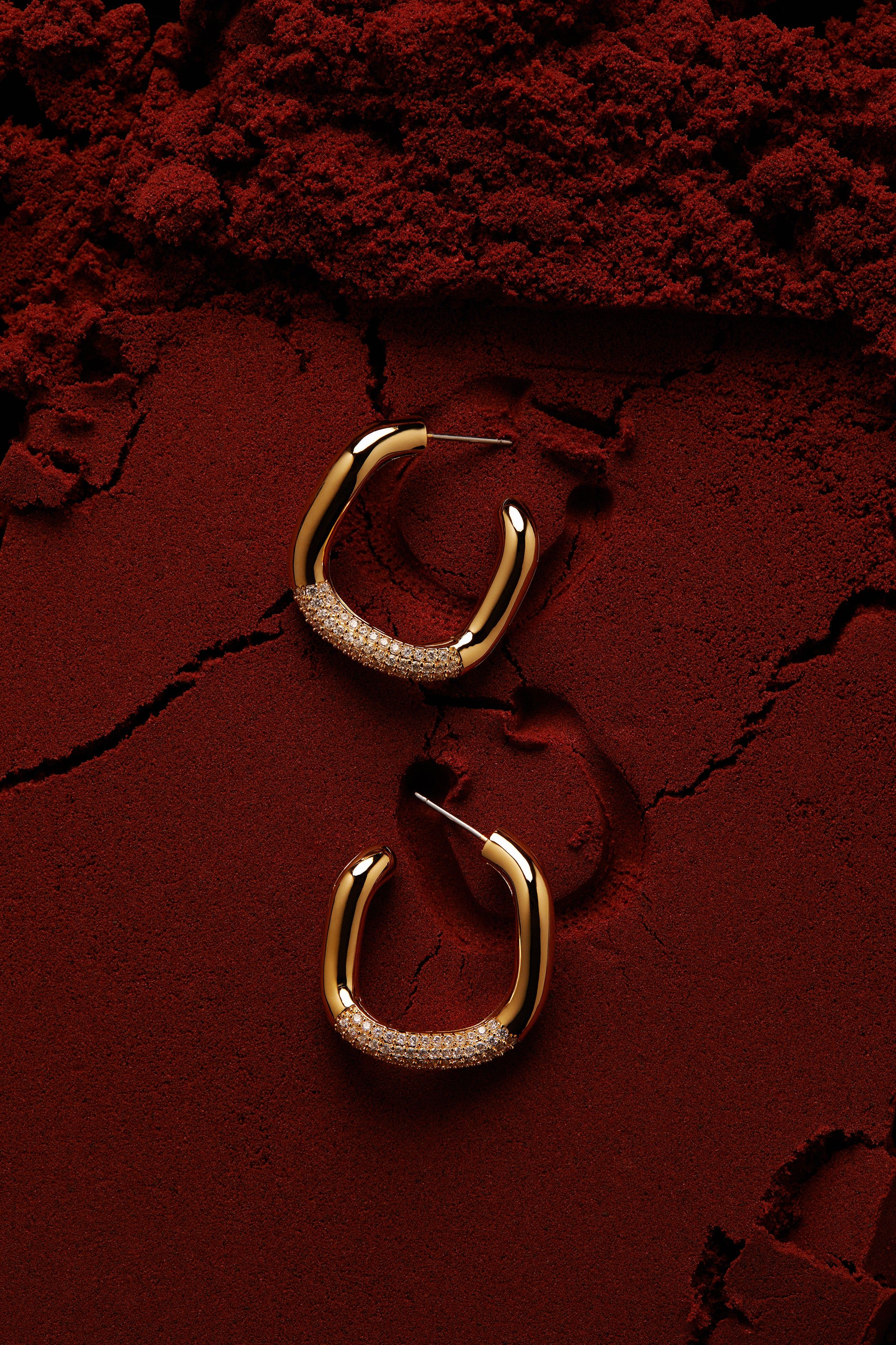Luxury Gold Hoop Earrings On Red Powder Genflow template preview