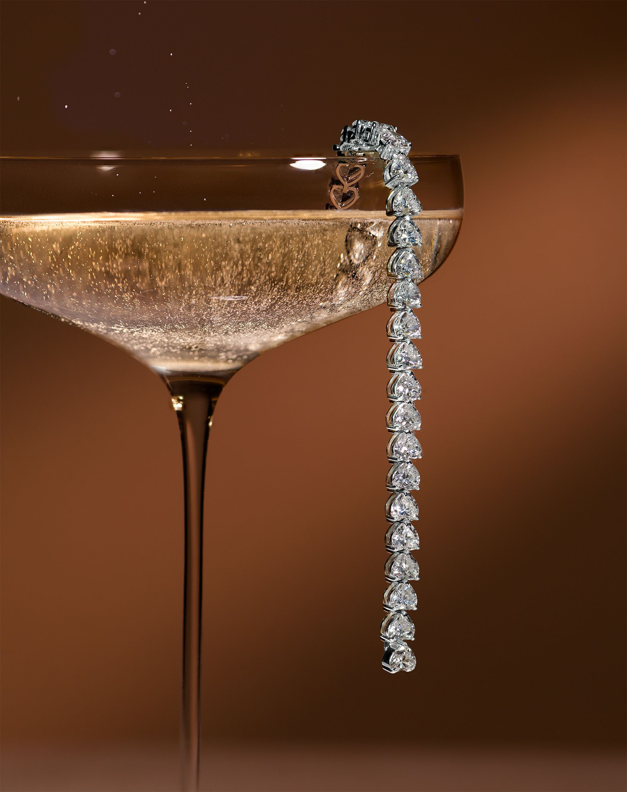 Diamond Bracelet Dripping Over Champagne Coupe Genflow template preview