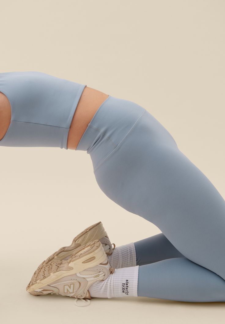 A Woman In Blue Leggings Doing A Yoga Pose With Her Creative Design Generator Genflow テンプレートプレビュー