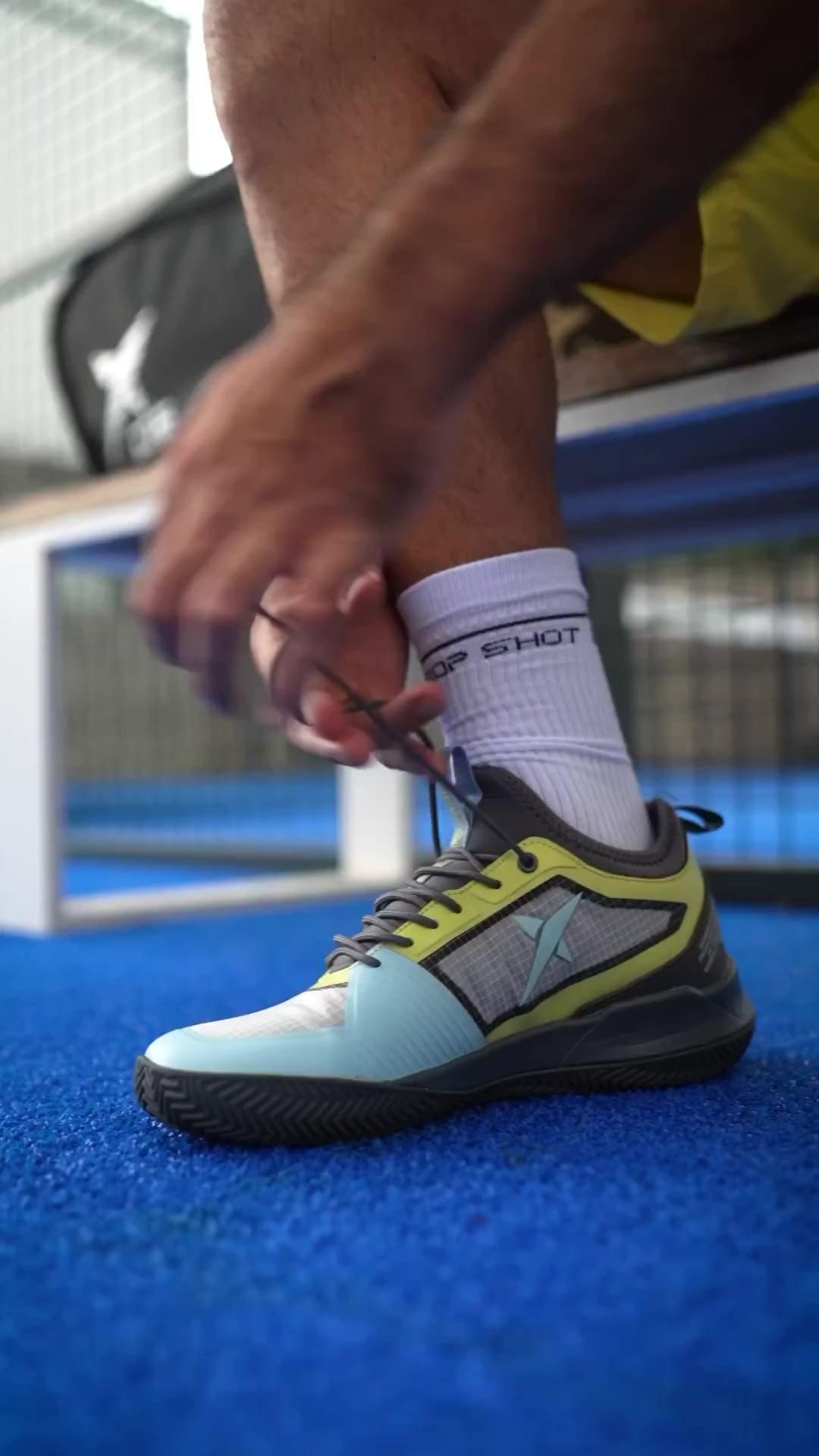 A Tennis Player Tying His Shoe Laces On The Blue Creative Design Generator Genflow template preview