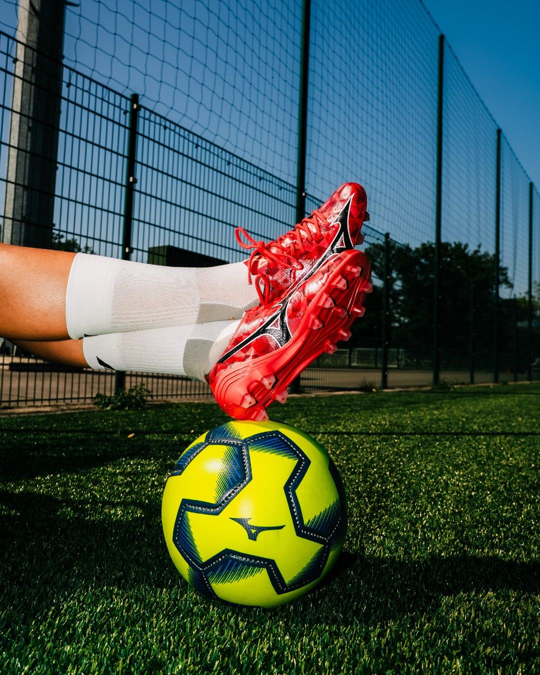 The Soccer Ball Is In Front Of A Person'S Legs And Creative Design Generator Genflow テンプレートプレビュー