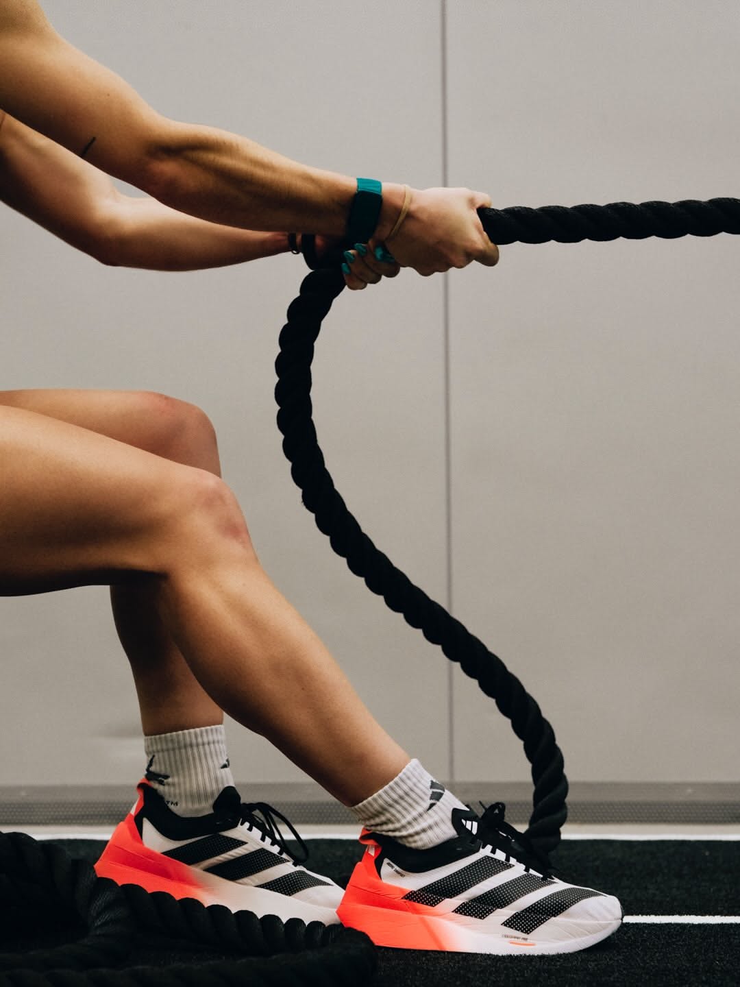 A Woman Is Tying Her Shoelaces With A Rope Creative Design Generator Genflow template preview