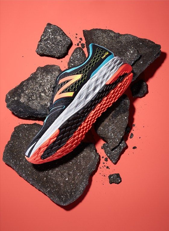 A Pair Of New Balance Running Shoes Laying On Top Of Creative Design Generator Genflow template preview
