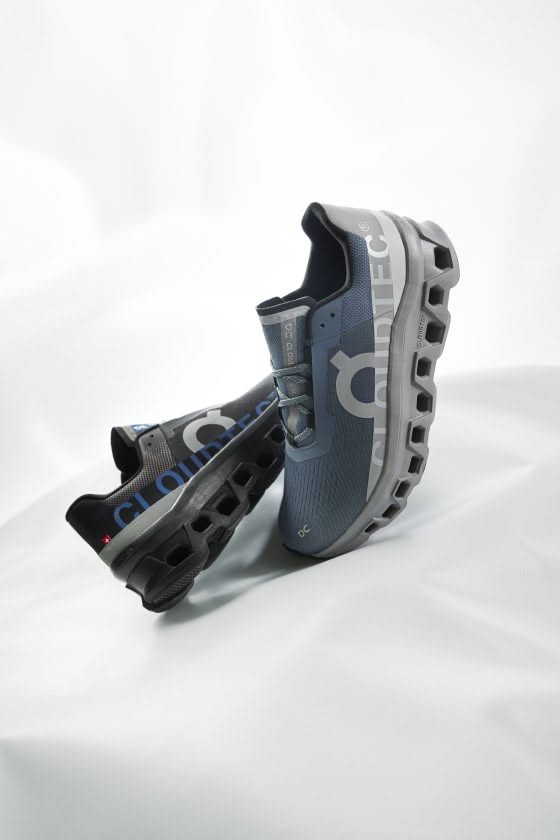 Two Pairs Of Running Shoes Sitting On Top Of A White Creative Design Generator Genflow 模板预览