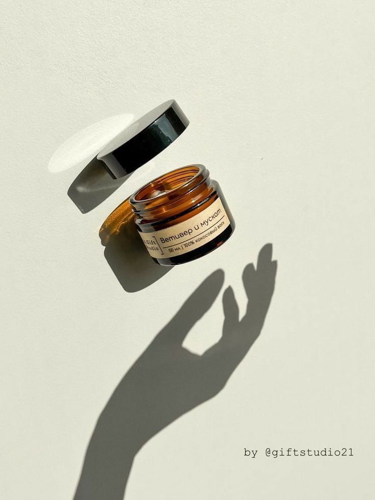 This May Contain: The Shadow Of A Person's Hand Next To A Jar Of Skin Care Product Creative Design Generator Genflow テンプレートプレビュー