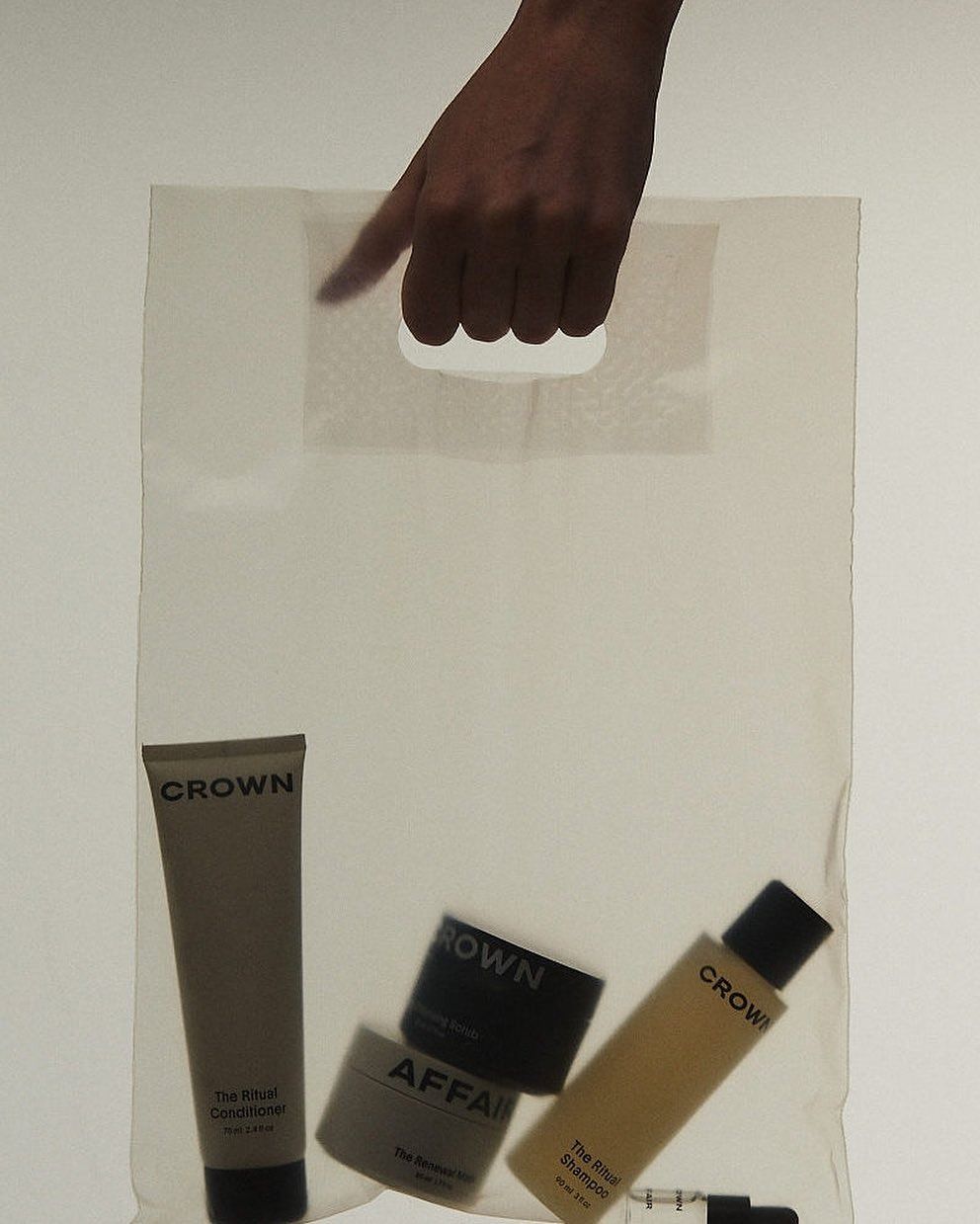 This May Contain: A Person's Hand Is Reaching Into A Clear Bag With Various Skin Care Prod Creative Design Generator Genflow template preview