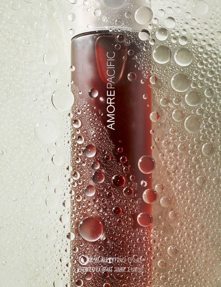 This May Contain: A Bottle Of Red Liquid Sitting On Top Of A Window Sill Covered In Water Creative Design Generator Genflow template preview