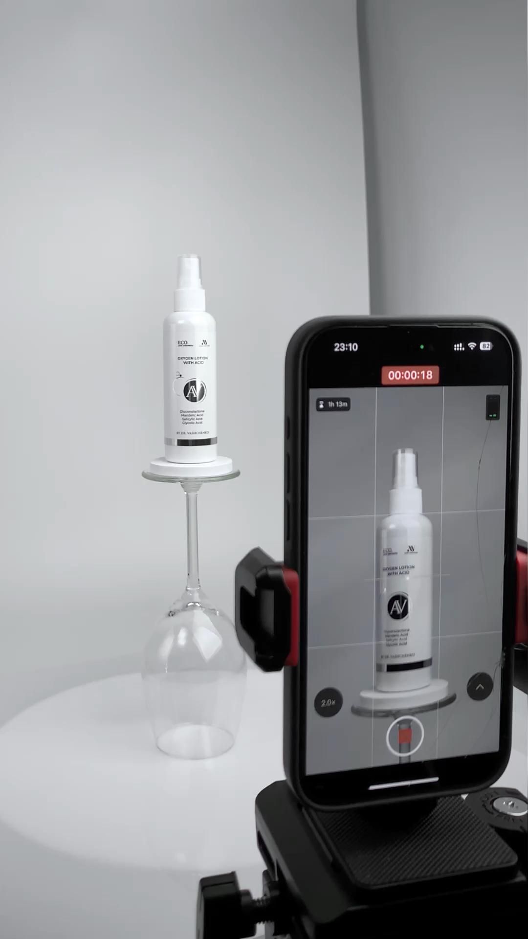 This May Contain: A Cell Phone Sitting On Top Of A Tripod Next To A Bottle Of Lotion Creative Design Generator Genflow 模板预览