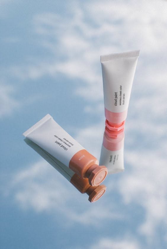 This May Contain: A Tube Of Sunscreen On Top Of A Tube Of Suncreen Against A Blue Sky Creative Design Generator Genflow テンプレートプレビュー