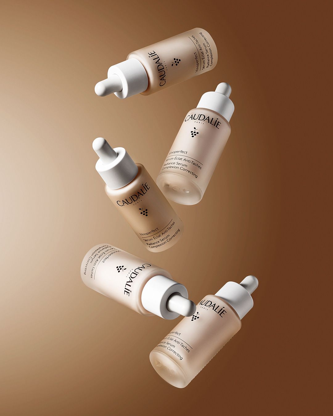 This May Contain: Three Bottles Of Skin Care On A Brown Background Creative Design Generator Genflow 模板預覽