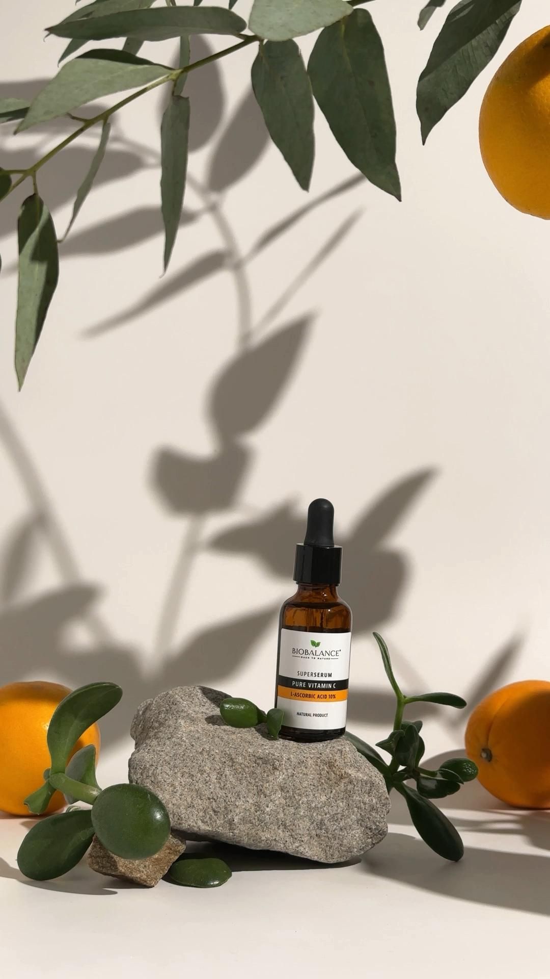 This May Contain: A Bottle Of Vitamin Oil Sitting On Top Of A Rock Next To Some Oranges Creative Design Generator Genflow テンプレートプレビュー
