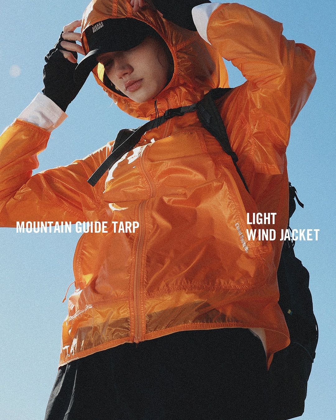 A Woman Wearing An Orange Jacket And Black Pants With The Words Mountain Guide Tarp On It Creative Design Generator Genflow テンプレートプレビュー