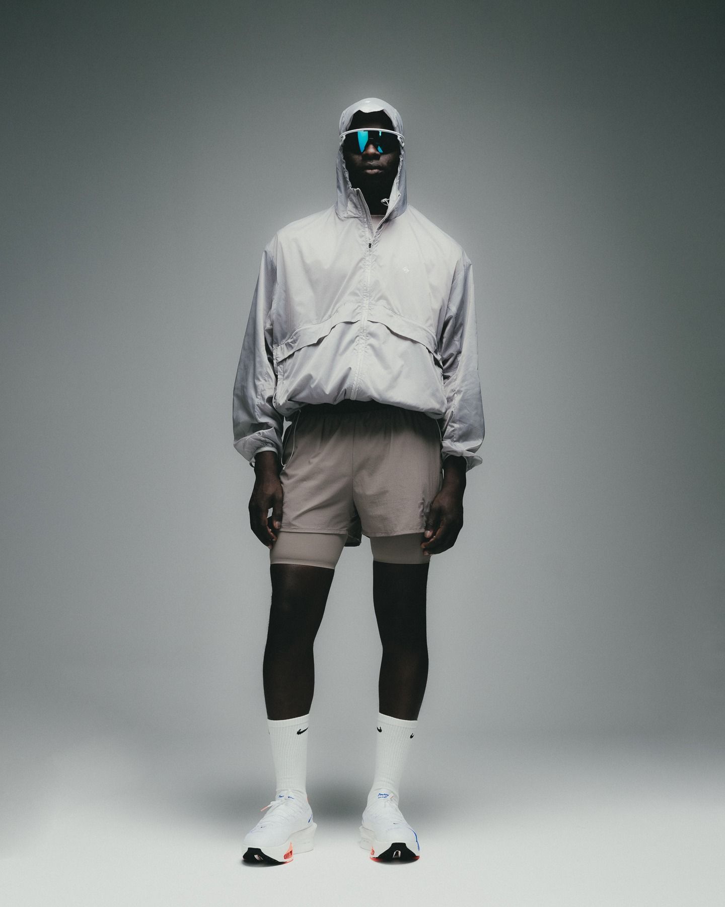 A Man In White Jacket And Shorts Standing On Grey Background Creative Design Generator Genflow template preview