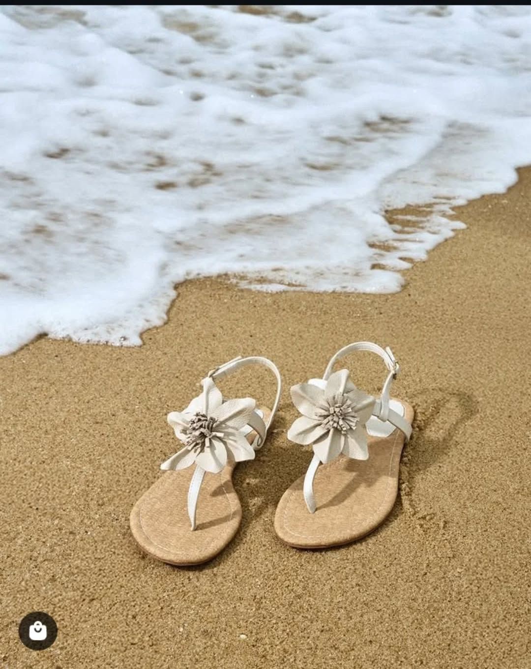 A Pair of Sandals Sitting on Top of a Sandy Beach Next to the Ocean with Waves Coming Creative Design Generator Genflow テンプレートプレビュー